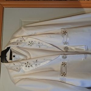 3 piece elegant suit with a tiny ink spot  on skirt excellent condition